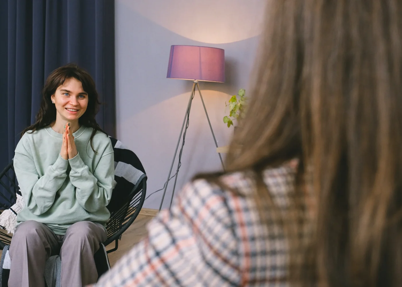 A person in drug rehab and therapy talking with the drug therapist.